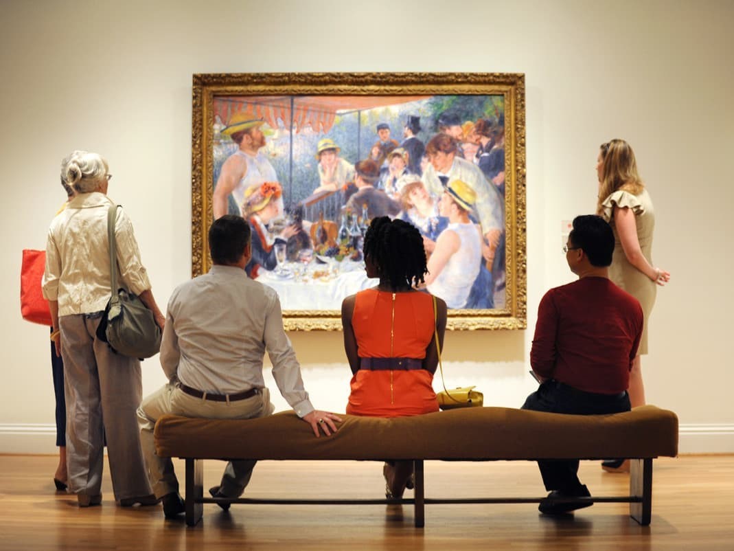 Museum visitors enjoying "The Luncheon of the Boating Party" 